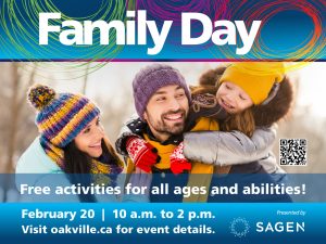 A woman, and a man with a child clinging to his neck are having a laugh outdoors in the winter. They're wearing colourful winter hats and coats.