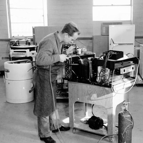 Worker repairing an appliance